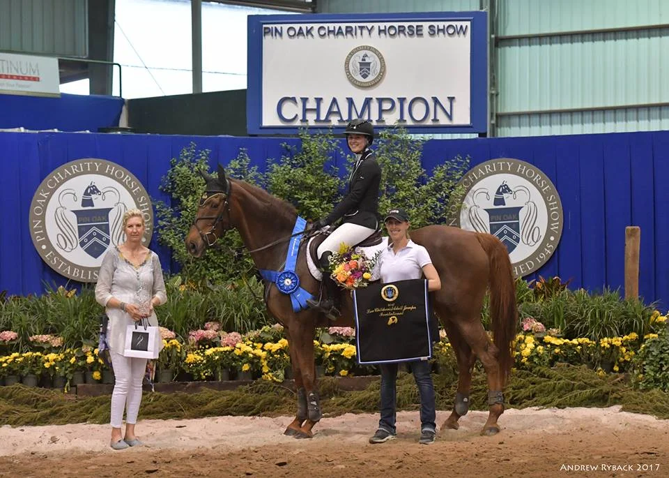 Coraggio rider and horse winning champion at the Pin Oak Charity Horse Show